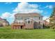 Rear exterior featuring a well-maintained lawn and architectural elements at 3728 Dunellen Cir, Carmel, IN 46074