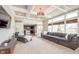 Spacious living room with coffered ceilings and views of the eat-in kitchen at 3728 Dunellen Cir, Carmel, IN 46074