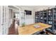Comfortable home office featuring custom shelving and a live edge wood desk at 3728 Dunellen Cir, Carmel, IN 46074