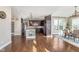 View of the open floor plan and kitchen with island and hardwood floors at 3728 Dunellen Cir, Carmel, IN 46074