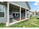This back porch has has a covered patio with ample seating, a grill, and string lights perfect for entertaining at 3971 Albert Ln, Bargersville, IN 46106