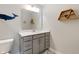 This bathroom features a modern vanity with gray cabinetry, sleek hardware, and an eye-catching whale decoration at 3971 Albert Ln, Bargersville, IN 46106