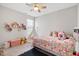 bedroom with soft carpet, a teepee, ceiling fan, and lots of toys and stuffed animals at 3971 Albert Ln, Bargersville, IN 46106