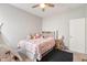 Cozy bedroom with plush carpet, a teepee, ceiling fan, and unique wall decorations at 3971 Albert Ln, Bargersville, IN 46106