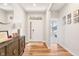 Bright and inviting foyer with hardwood floors, neutral walls, and a view into a bedroom at 3971 Albert Ln, Bargersville, IN 46106