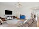 Comfortable living room featuring hardwood floors, an entertainment center, and an open layout at 3971 Albert Ln, Bargersville, IN 46106