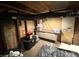 An unfinished basement area with exposed ductwork, storage containers and a vintage looking storage cabinet at 4029 W Fairview Rd, Greenwood, IN 46142
