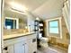 A bright and clean bathroom with a large mirror, vanity, and stylish fixtures at 4029 W Fairview Rd, Greenwood, IN 46142