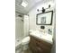 Updated bathroom featuring a wood vanity, updated tiling in the shower and floors at 4029 W Fairview Rd, Greenwood, IN 46142