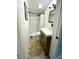 Updated bathroom featuring a wood vanity, updated tiling in the shower and floors at 4029 W Fairview Rd, Greenwood, IN 46142