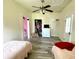 Bedroom featuring two beds, a dresser, and a closet with clothes visible at 4029 W Fairview Rd, Greenwood, IN 46142
