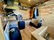 A cozy closet with wood paneling featuring ample storage, shelving, and hanging space for clothes and luggage at 4029 W Fairview Rd, Greenwood, IN 46142