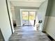 This entryway contains sliding glass doors that lead out to a deck in the backyard at 4029 W Fairview Rd, Greenwood, IN 46142