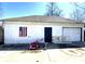 Exterior view of the garage featuring traditional architecture, ample parking, and a flag accent at 4029 W Fairview Rd, Greenwood, IN 46142