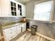 Kitchen area features white cabinets, stainless steel appliances and granite countertops at 4029 W Fairview Rd, Greenwood, IN 46142