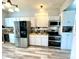 Modern kitchen with stainless steel appliances, granite countertops and custom cabinetry at 4029 W Fairview Rd, Greenwood, IN 46142