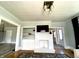 Cozy living room with a decorative fireplace, TV, shelving and modern lighting at 4029 W Fairview Rd, Greenwood, IN 46142
