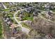 Aerial view of a lush neighborhood showcasing a home in a serene and well-maintained community at 4312 S Woodbridge Ln, New Palestine, IN 46163