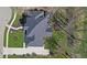 Aerial view of a house featuring a spacious backyard, patio and meticulous landscaping at 4312 S Woodbridge Ln, New Palestine, IN 46163