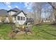 Outdoor space featuring a cozy fire pit with chairs for entertaining at 4312 S Woodbridge Ln, New Palestine, IN 46163