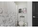 Cozy bathroom features a toilet and a white shower curtain with a floral design at 4312 S Woodbridge Ln, New Palestine, IN 46163