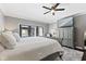 Relax in this king-sized bed, with soft lighting and a TV for a comfy bedroom experience at 4312 S Woodbridge Ln, New Palestine, IN 46163