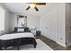 Cozy bedroom featuring a ceiling fan, closet, and contemporary art at 4312 S Woodbridge Ln, New Palestine, IN 46163