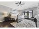 This bedroom offers a soft rug, gray walls and a king-sized bed for a peaceful retreat at 4312 S Woodbridge Ln, New Palestine, IN 46163