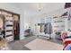Spacious walk-in closet featuring shelving, storage, carpeting, and a chandelier at 4312 S Woodbridge Ln, New Palestine, IN 46163
