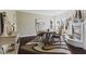 An elegant dining room is displayed, complete with fireplace and decorative rug at 4312 S Woodbridge Ln, New Palestine, IN 46163