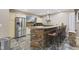 Wet bar area includes stainless appliances, stone accents, and bar seating at 4312 S Woodbridge Ln, New Palestine, IN 46163