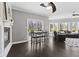 Open living area featuring a dining space, fireplace, sliding doors, and comfortable seating at 4312 S Woodbridge Ln, New Palestine, IN 46163