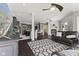 Open-concept living space with seating, fireplace, kitchen view, and modern decor at 4312 S Woodbridge Ln, New Palestine, IN 46163