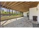 Covered patio area with gravel flooring and access to the backyard at 4312 S Woodbridge Ln, New Palestine, IN 46163
