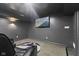Basement theater room with tiered seating and a flat screen television at 4312 S Woodbridge Ln, New Palestine, IN 46163