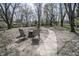 Outdoor seating area in a shaded backyard under mature trees at 4342 Lasalle St, Indianapolis, IN 46205