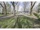 Shaded backyard with mature trees and a small storage shed at 4342 Lasalle St, Indianapolis, IN 46205