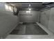 Unfinished basement with painted block walls, exposed ductwork, and rubber flooring at 4342 Lasalle St, Indianapolis, IN 46205