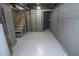 The partially finished basement features painted walls and unfinished stairs at 4342 Lasalle St, Indianapolis, IN 46205
