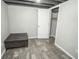 Finished basement featuring gray walls, wood-look floors and a storage closet at 4342 Lasalle St, Indianapolis, IN 46205