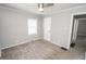 Cozy carpeted bedroom featuring a ceiling fan, and lots of natural light at 4342 Lasalle St, Indianapolis, IN 46205