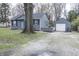 Cozy home with a detached garage and a stone-lined walkway enhancing its outdoor charm at 4342 Lasalle St, Indianapolis, IN 46205