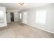 Inviting living room with an open layout and neutral tones, seamlessly connecting to the kitchen at 4342 Lasalle St, Indianapolis, IN 46205