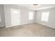 Bright and airy living room with neutral carpet, creating a comfortable and inviting space at 4342 Lasalle St, Indianapolis, IN 46205