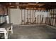 Inside the detached garage shows a concrete floor, exposed studs, and a workbench at 4431 Bertrand Rd, Indianapolis, IN 46222