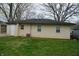 View of the detached garage showing the side entrance door and air conditioning unit at 4431 Bertrand Rd, Indianapolis, IN 46222