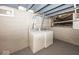 Finished basement with laundry area and white appliances at 4742 Primrose Ave, Indianapolis, IN 46205