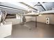 Unfinished basement with painted floor, mechanicals, and exposed ceiling at 4742 Primrose Ave, Indianapolis, IN 46205