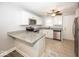 Bright kitchen with ample cabinet space, granite countertops, and stainless steel appliances at 4742 Primrose Ave, Indianapolis, IN 46205