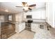 Modern kitchen with stainless steel appliances, granite countertops, and easy access to living room at 4742 Primrose Ave, Indianapolis, IN 46205